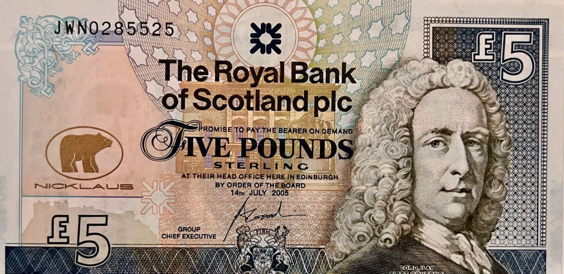 A close up of the royal bank of scotland plc five pound note